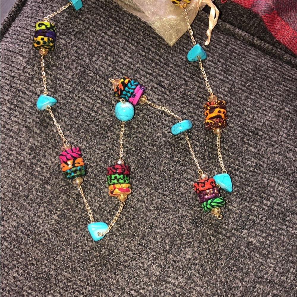 Necklace: Handmade with Blue Stone and handmade round fabric design
